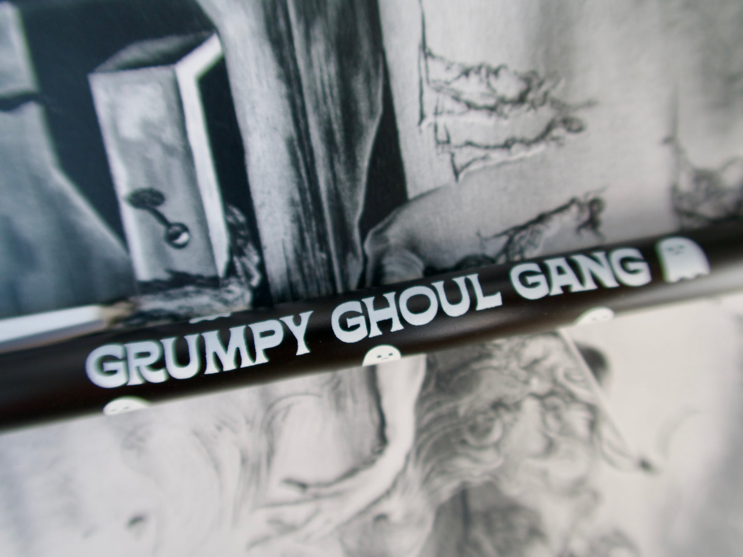 Black pencil with 'Grumpy Ghoul Gang' text against a black and white background